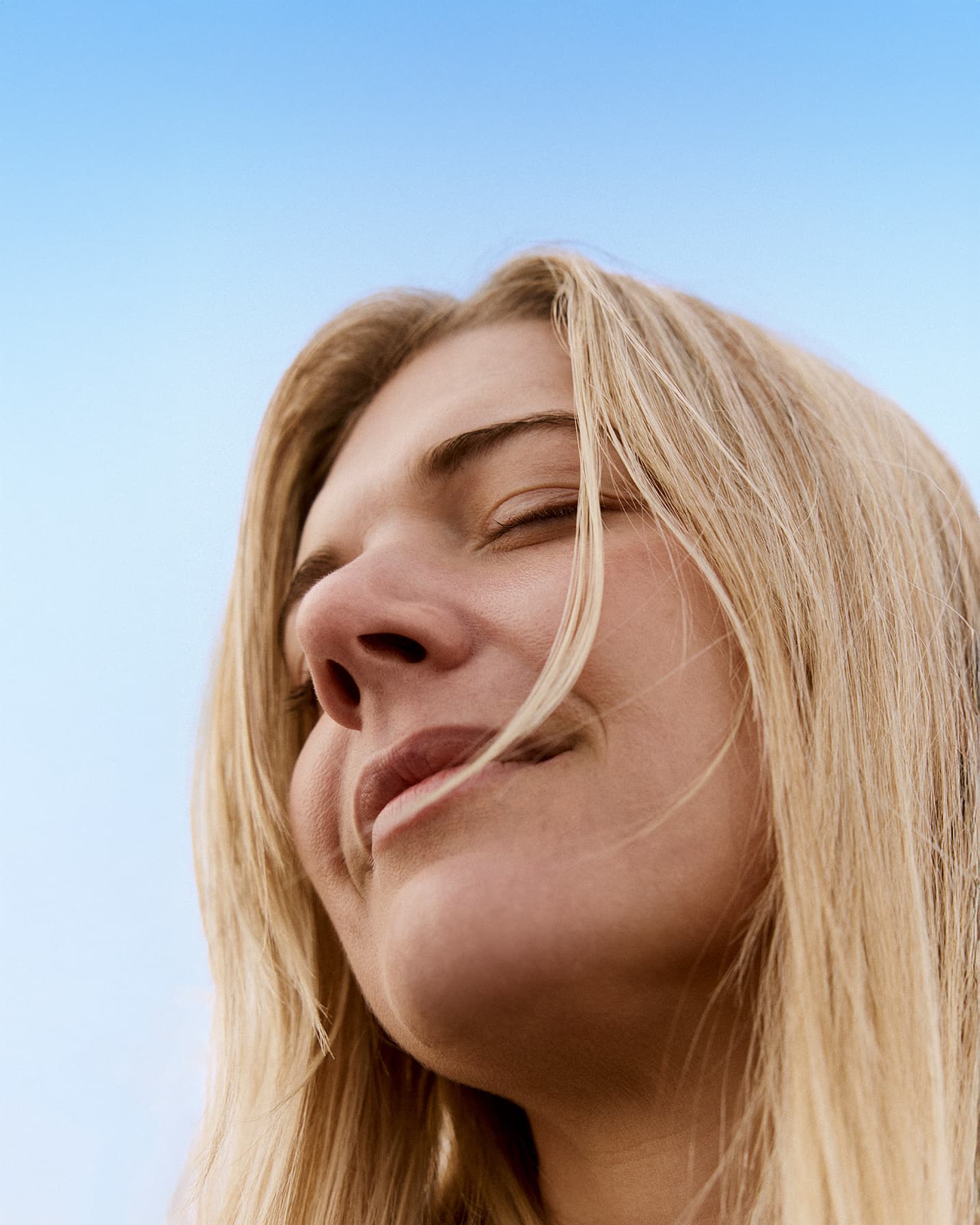 blonde woman smiling and relaxed