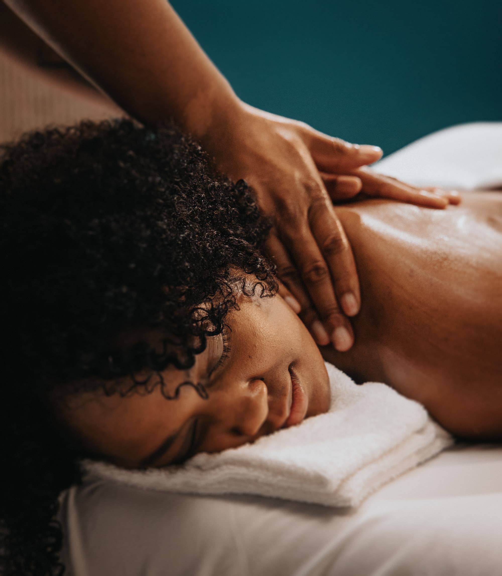Person receiving massage at Hand and Stone Massage and Facial Spa