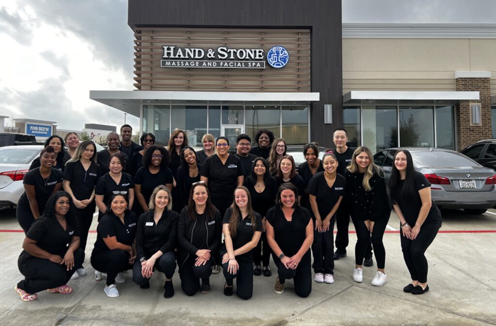 Group of Spa employees standing in parking lot